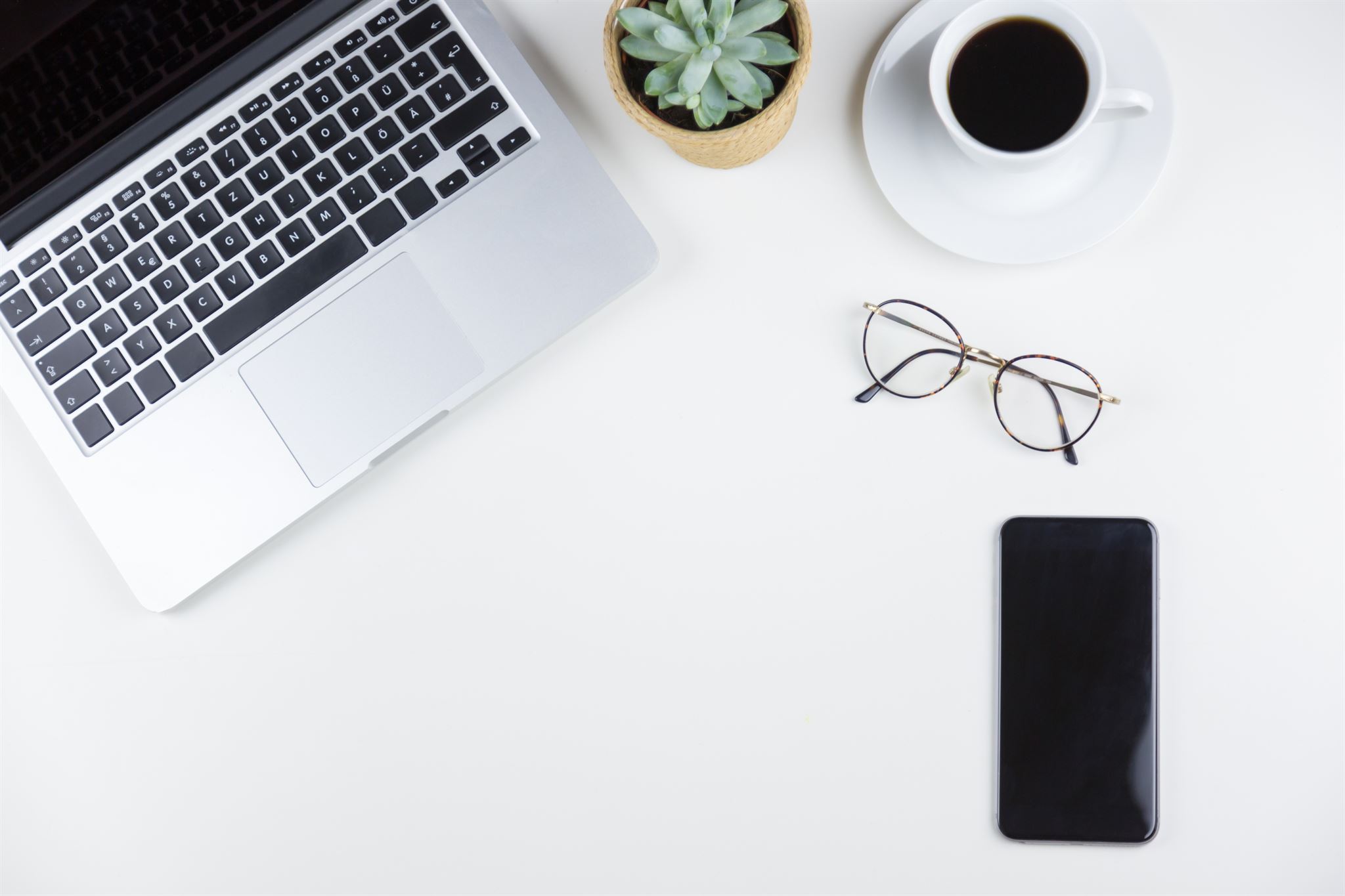 High-angle-view-of-a-work-table-with-a-laptop